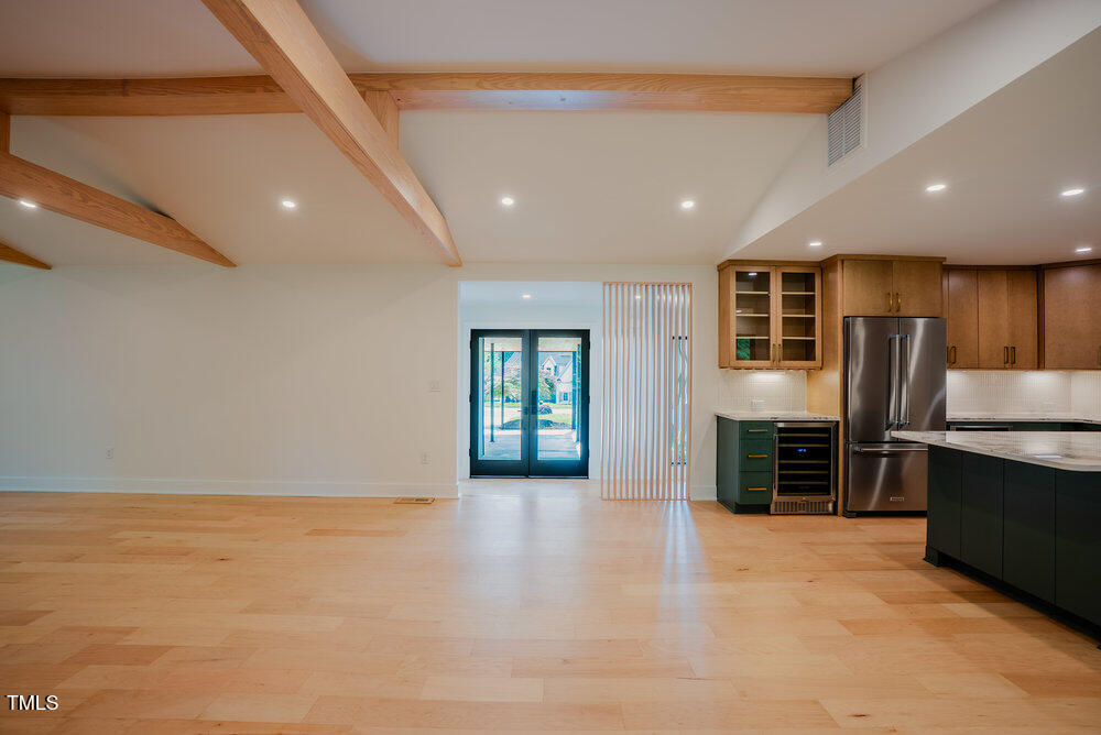 2129 Ridge Road Raleigh, NC 27607 - Photo 18 of 56 a view of kitchen with stainless steel appliances kitchen island wooden floor and window