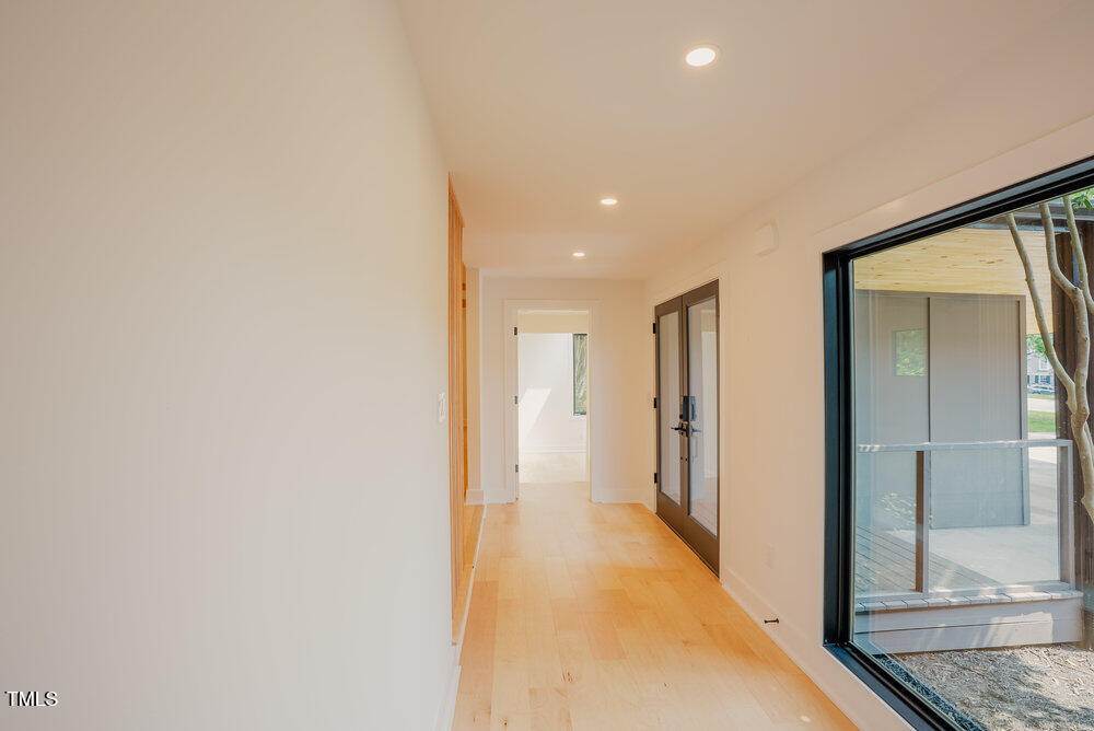 2129 Ridge Road Raleigh, NC 27607 - Photo 22 of 56 a view of hallway with wooden floor