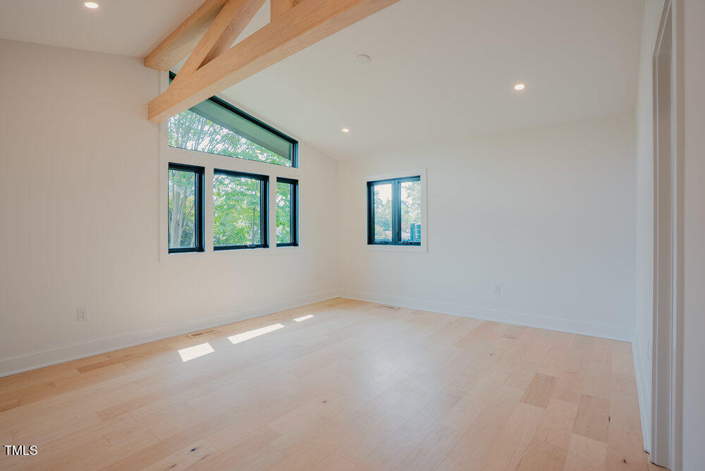 2129 Ridge Road Raleigh, NC 27607 - Photo 26 of 56 an empty room with a window