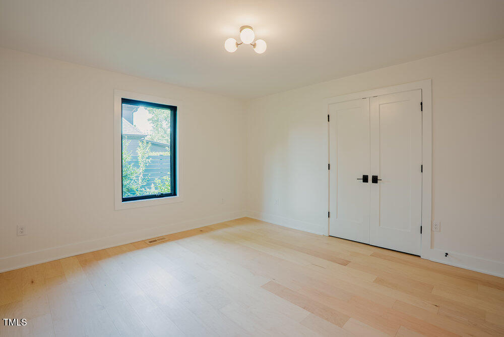 2129 Ridge Road Raleigh, NC 27607 - Photo 30 of 56 a view of an empty room with a window