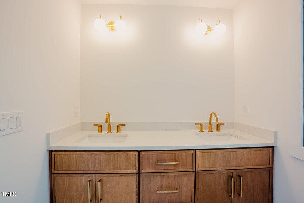 2129 Ridge Road Raleigh, NC 27607 - Photo 33 of 56 a bathroom with a sink and a vanity