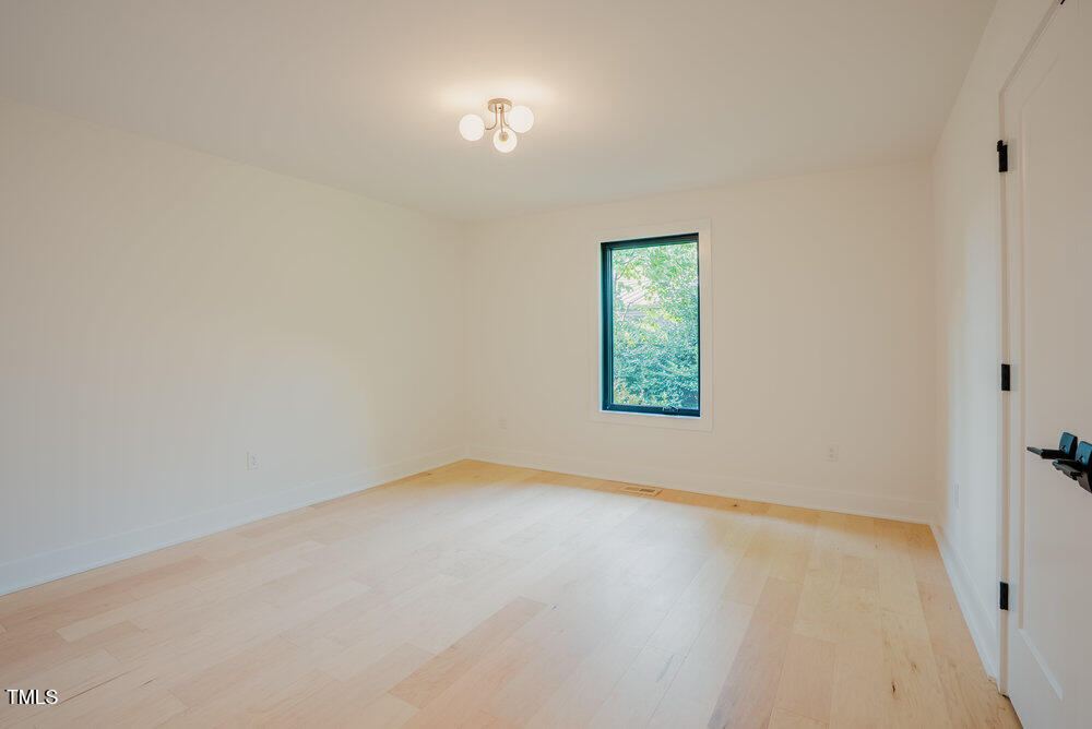 2129 Ridge Road Raleigh, NC 27607 - Photo 34 of 56 an empty room with a window
