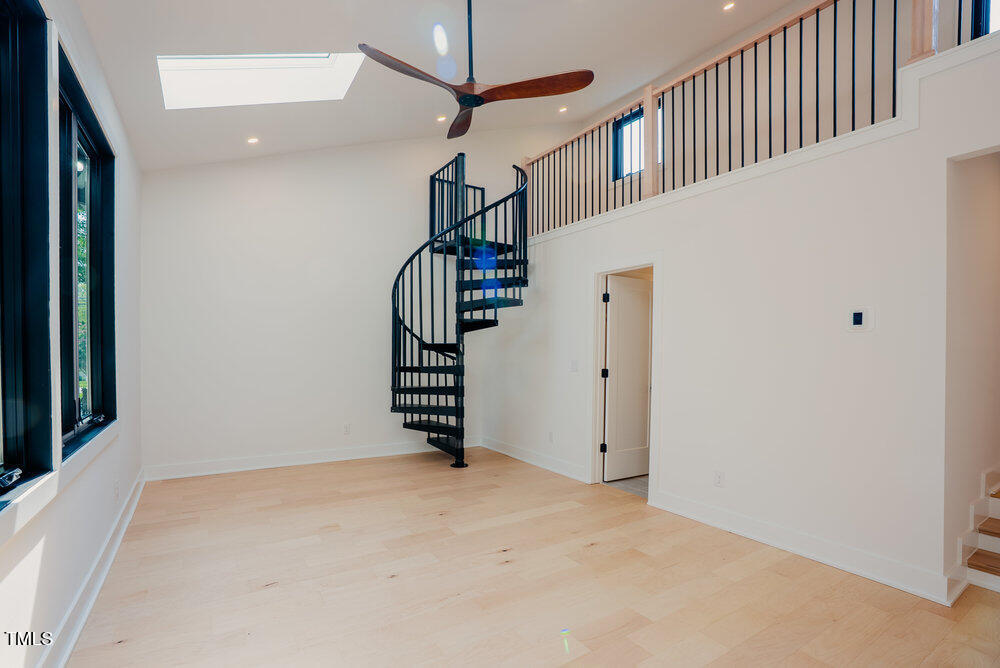 2129 Ridge Road Raleigh, NC 27607 - Photo 36 of 56 a view of an empty room with stairs
