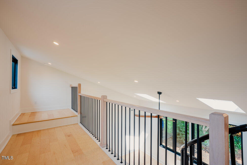 2129 Ridge Road Raleigh, NC 27607 - Photo 39 of 56 a view of a hallway with stairs
