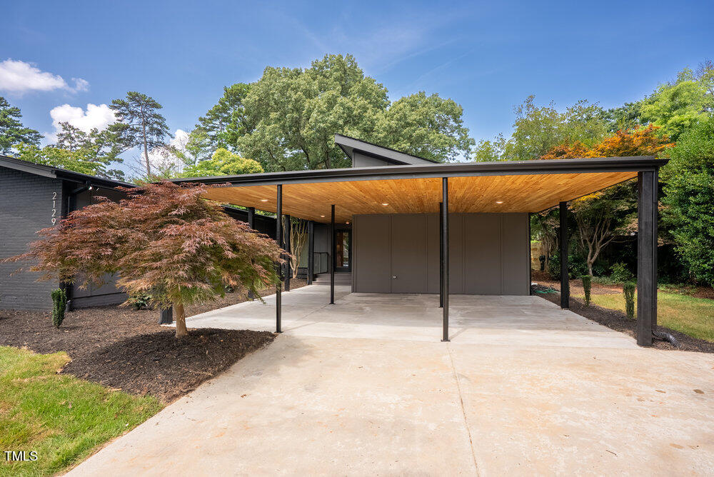 2129 Ridge Road Raleigh, NC 27607 - Photo 4 of 56 a view of a backyard with a patio
