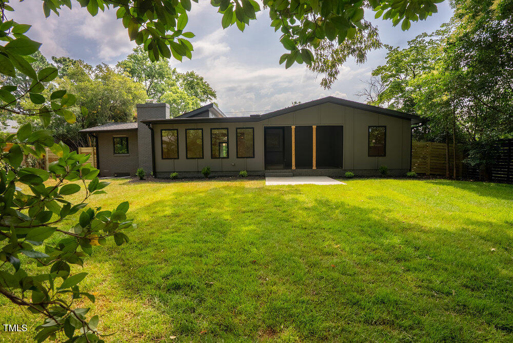 2129 Ridge Road Raleigh, NC 27607 - Photo 47 of 56 a front view of house with yard and trees in the background
