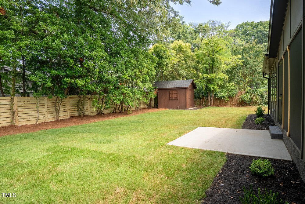 2129 Ridge Road Raleigh, NC 27607 - Photo 48 of 56 a view of a backyard with a garden