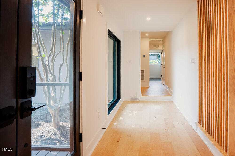 2129 Ridge Road Raleigh, NC 27607 - Photo 9 of 56 a view of a bathroom from a hallway