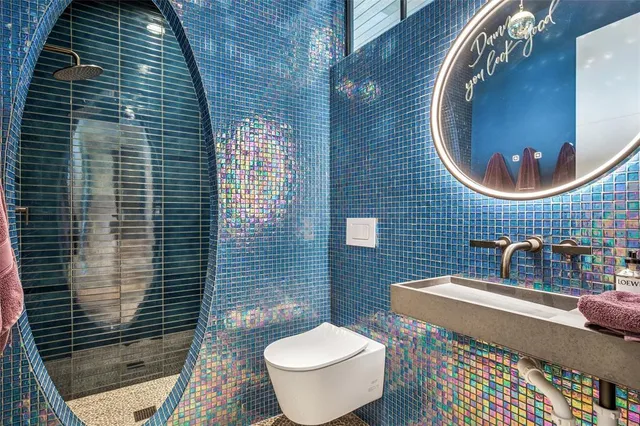 a bathroom with a toilet and a sink