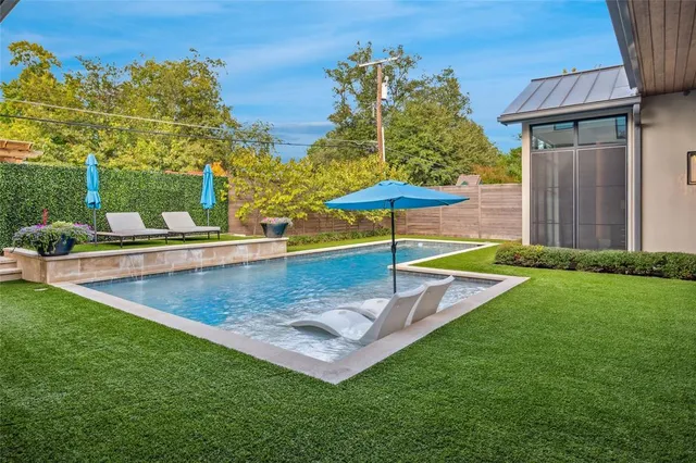 a view of a backyard with a patio