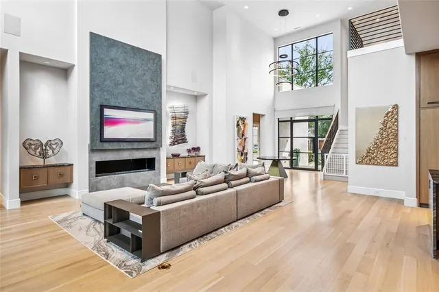 a living room with fireplace furniture and a flat screen tv