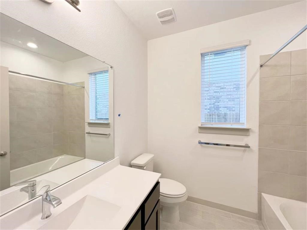28310 Hazel Trail Katy, TX 77494 - Photo 4 of 26 a bathroom with a sink a toilet and shower