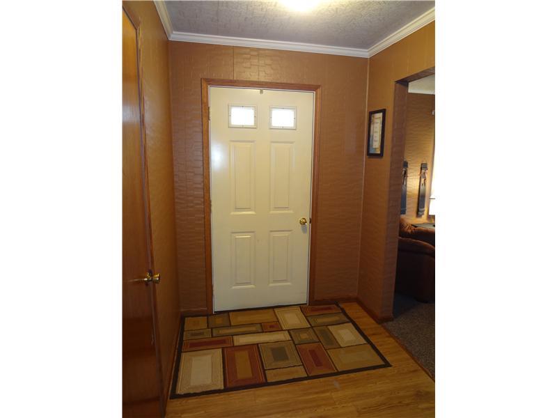 384 Gillespie Road Dawson, PA 15428 - Photo 3 of 25 Entry/Foyer. Welcoming Foyer leads to the Kitchen area and opens to the Living Room.