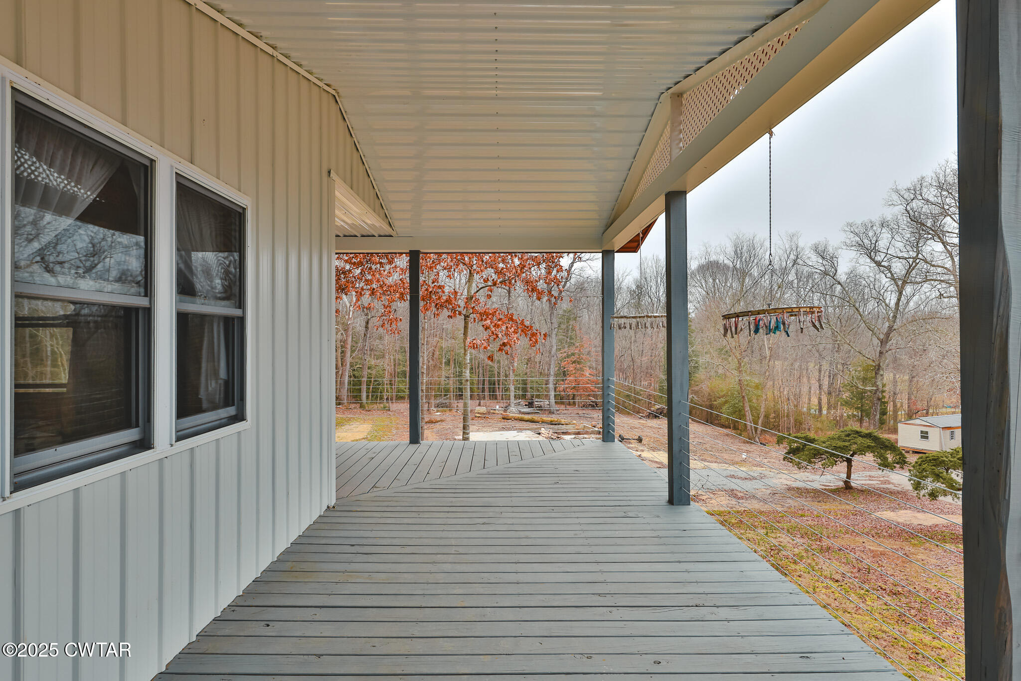 1421 Copper Spring Road Springville, TN 38256 - Photo 13 of 79 a porch with wooden floor and city view