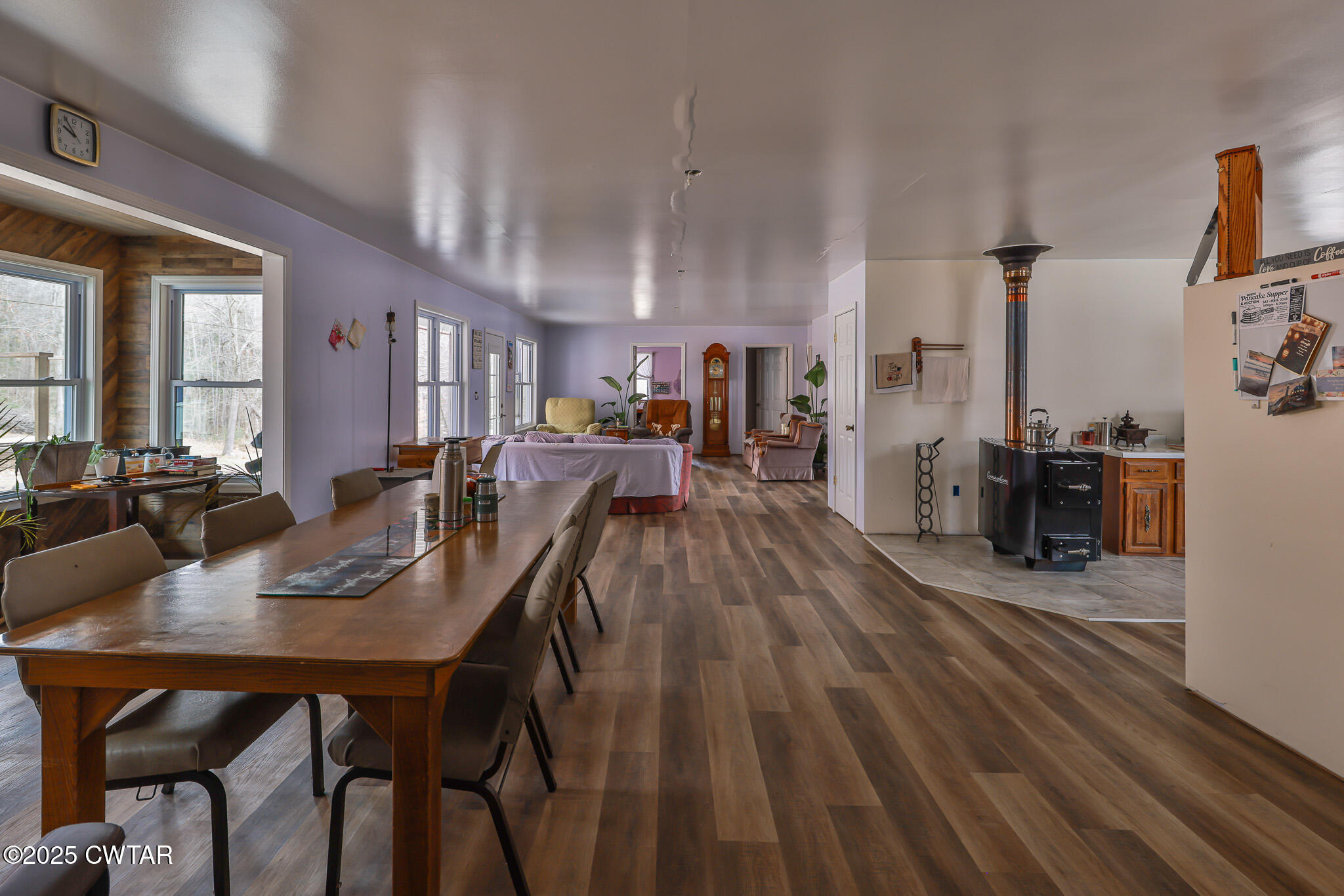 1421 Copper Spring Road Springville, TN 38256 - Photo 17 of 79 a view of a dining room with furniture and wooden floor