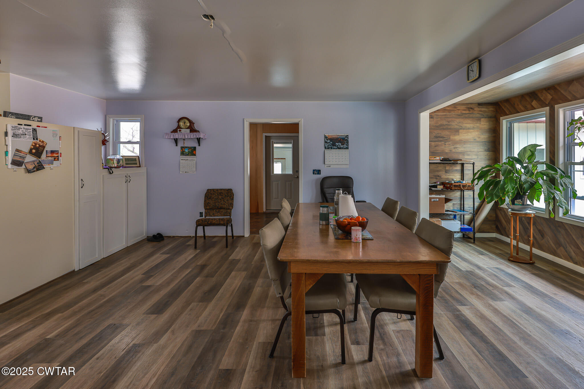 1421 Copper Spring Road Springville, TN 38256 - Photo 19 of 79 a view of a dining room with furniture and wooden floor