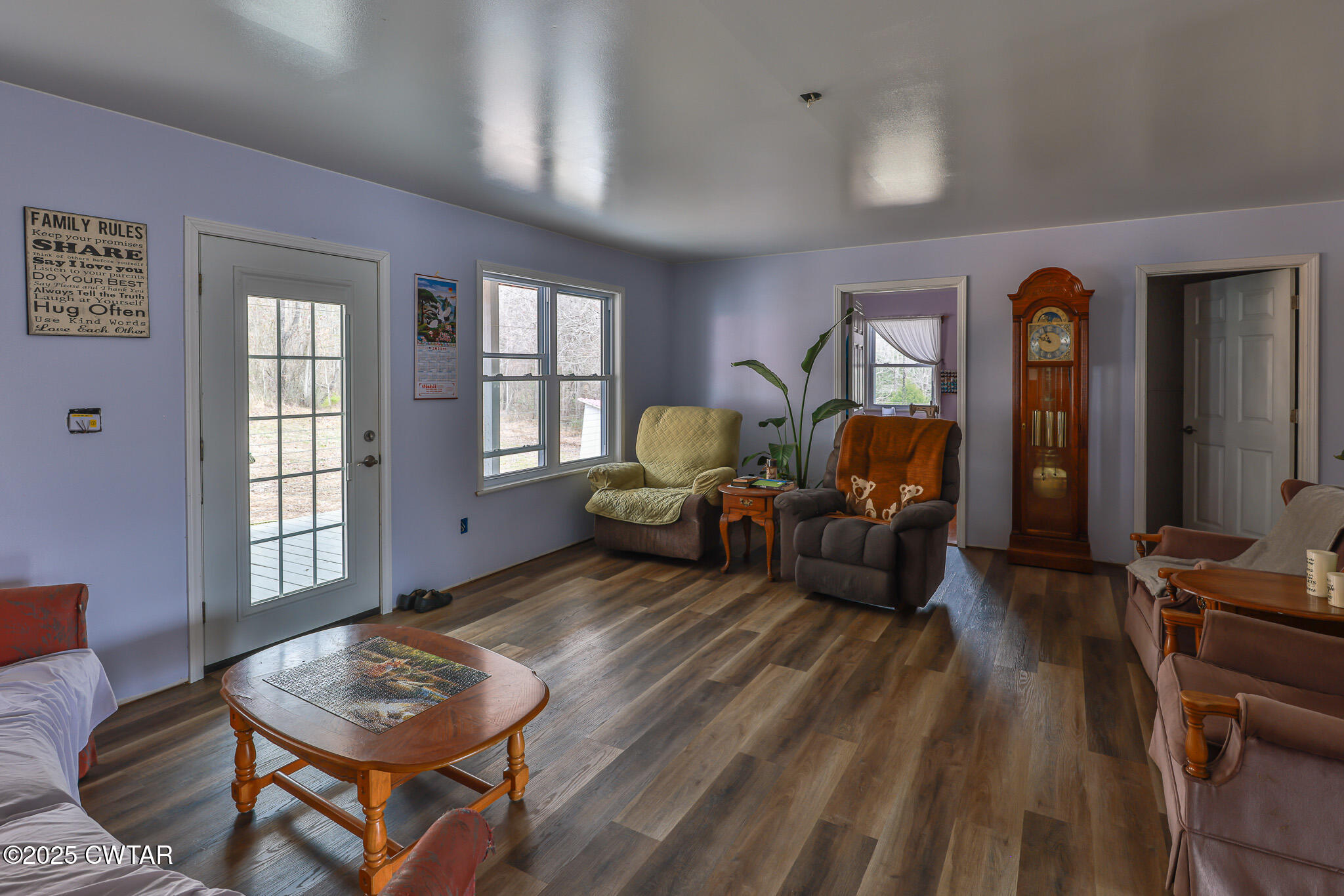 1421 Copper Spring Road Springville, TN 38256 - Photo 21 of 79 a living room with furniture and wooden floor