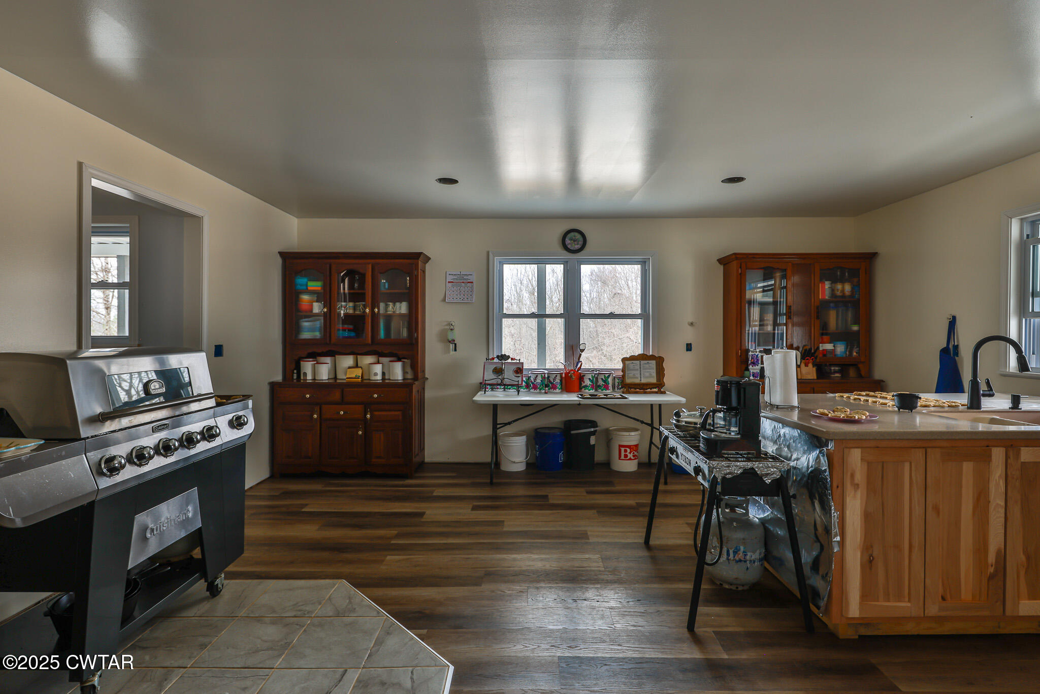 1421 Copper Spring Road Springville, TN 38256 - Photo 23 of 79 a living room with furniture a flat screen tv and a stove
