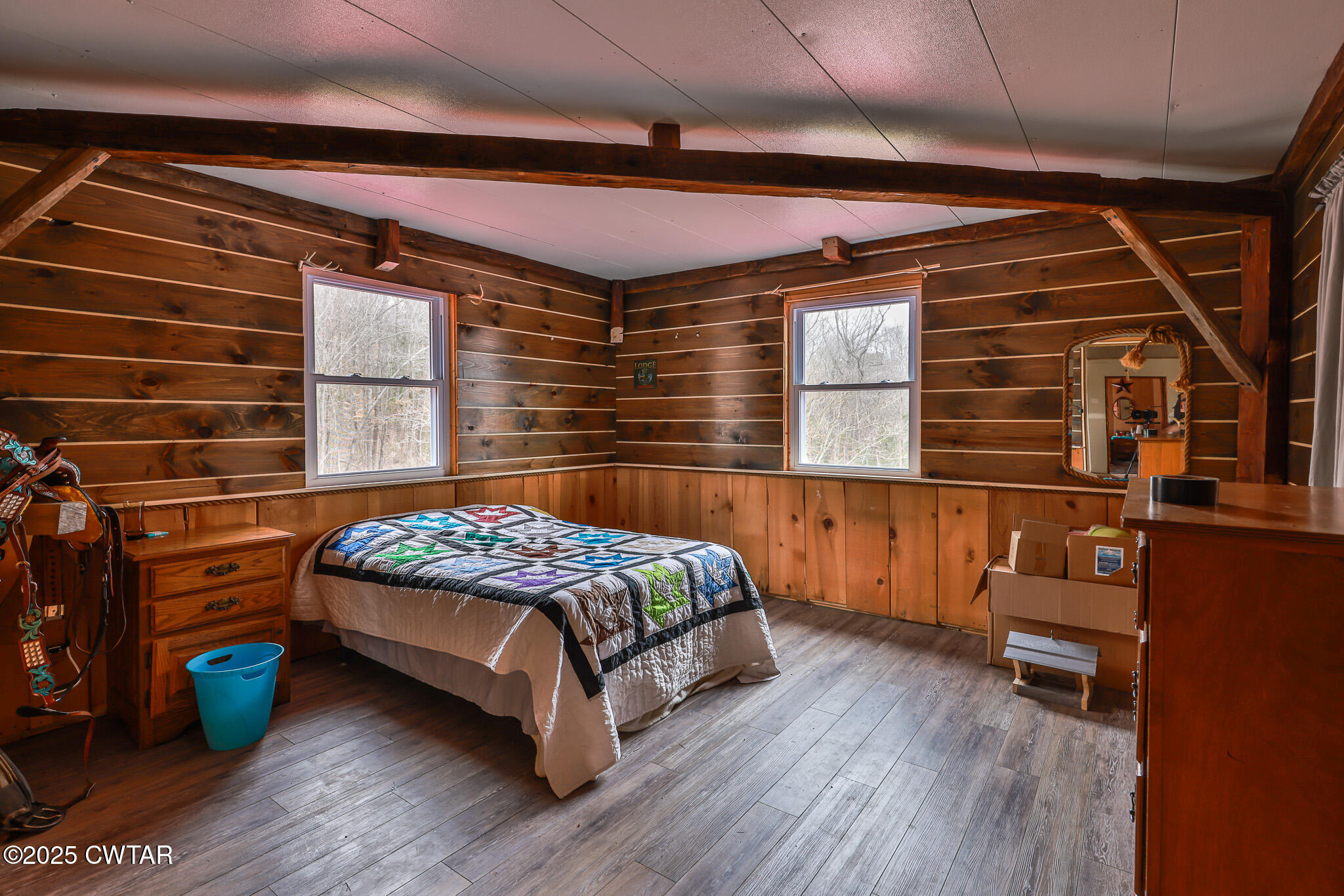 1421 Copper Spring Road Springville, TN 38256 - Photo 30 of 79 a bedroom with a bed and a chair