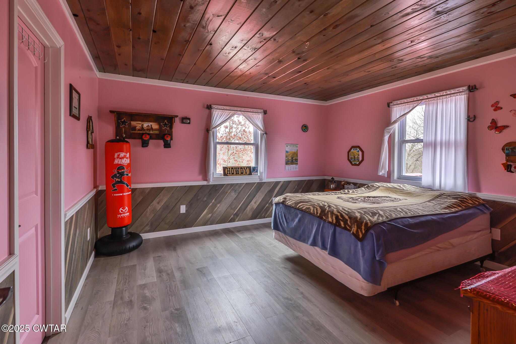 1421 Copper Spring Road Springville, TN 38256 - Photo 31 of 79 a bedroom with a bed and a dresser next to a window