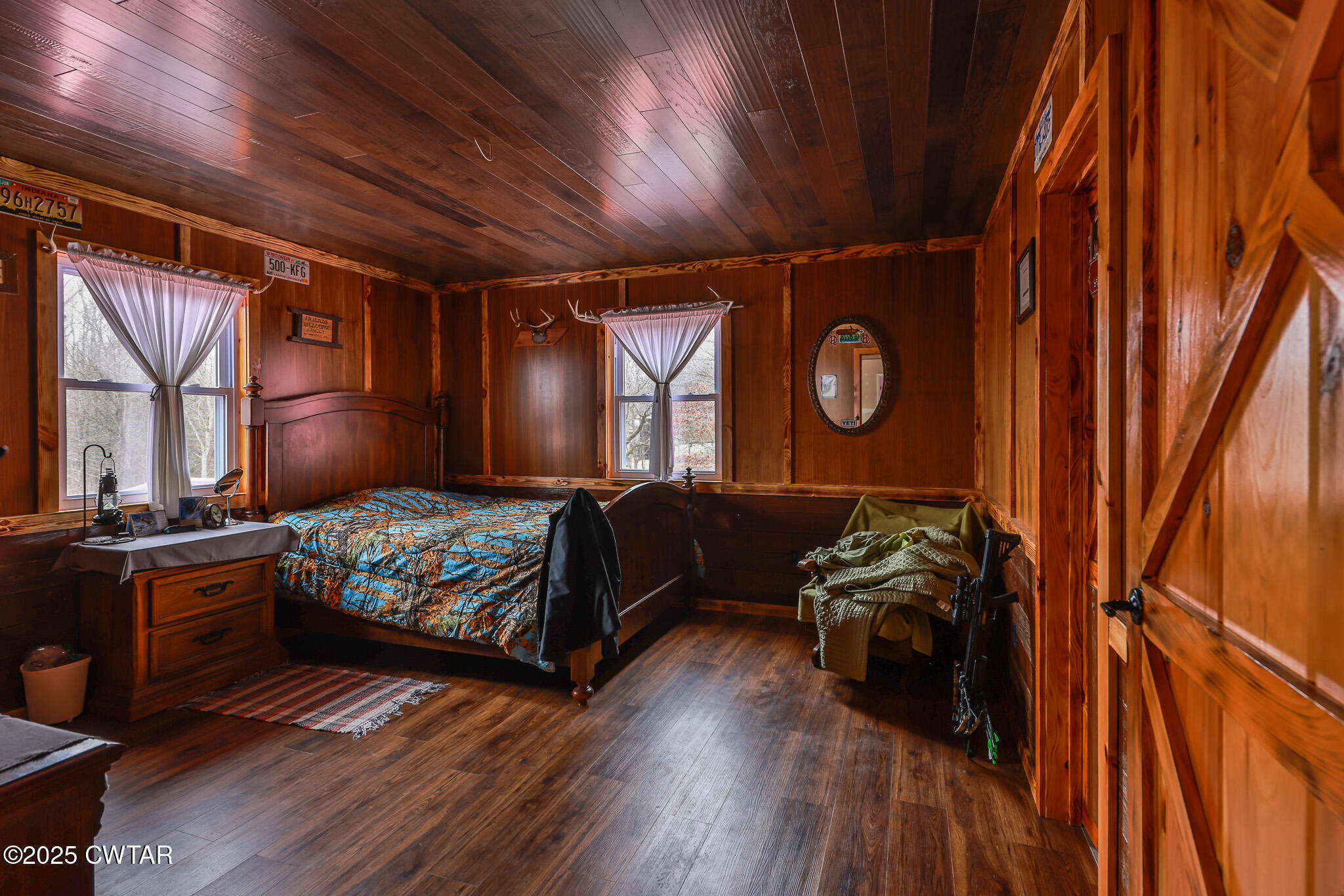 1421 Copper Spring Road Springville, TN 38256 - Photo 32 of 79 a bedroom with a bed and wooden floor