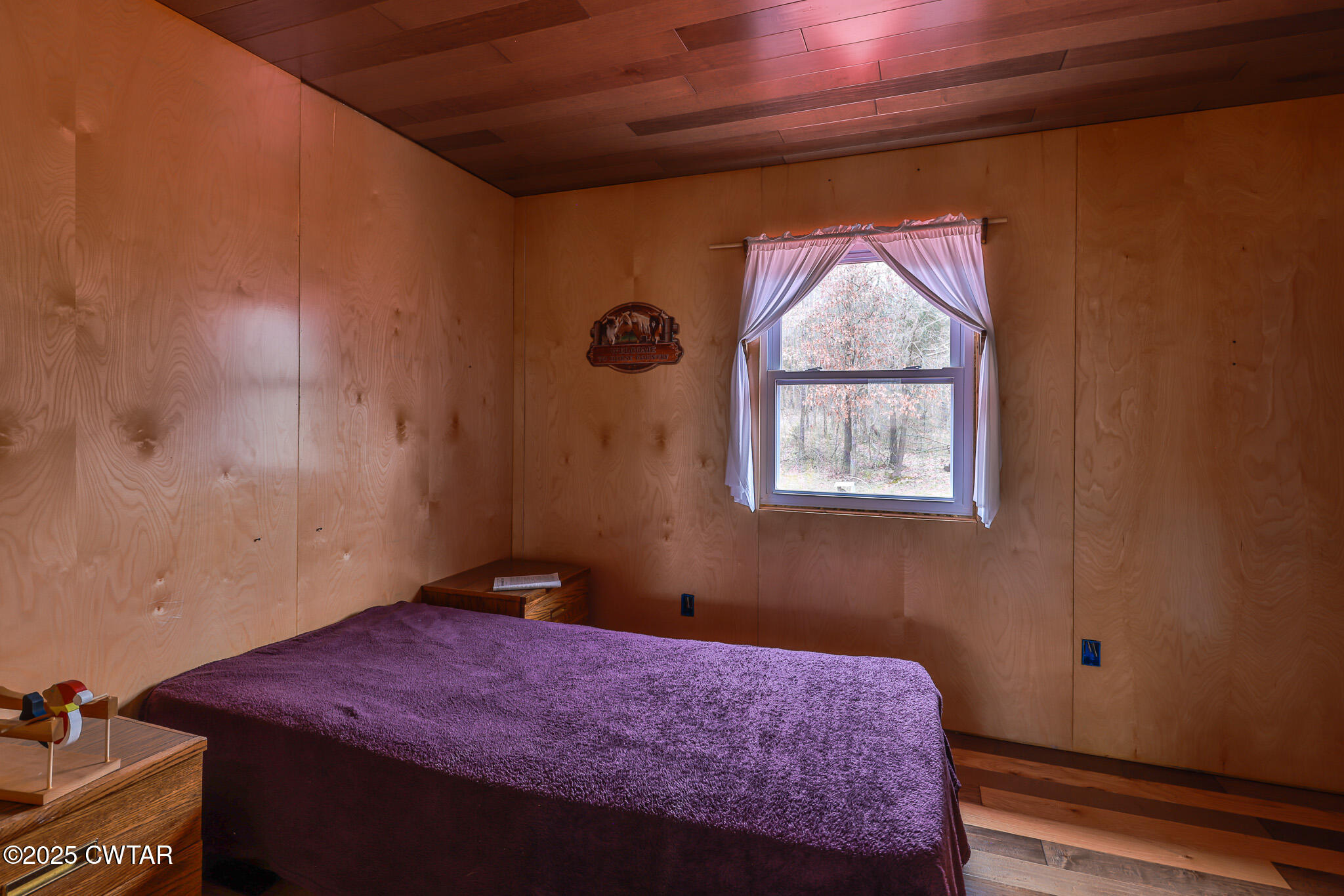 1421 Copper Spring Road Springville, TN 38256 - Photo 34 of 79 a bedroom with a bed and a window