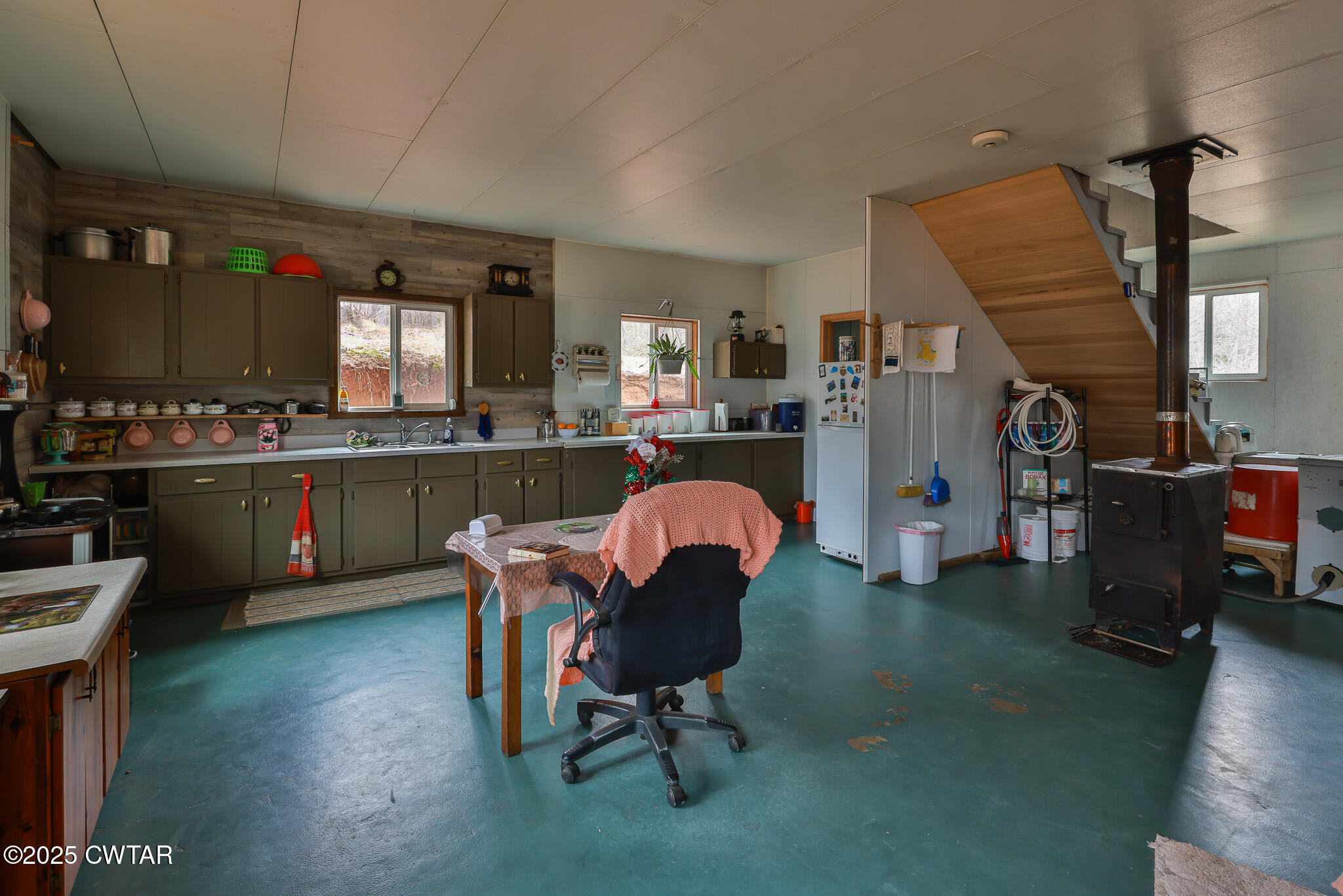 1421 Copper Spring Road Springville, TN 38256 - Photo 36 of 79 a living room with furniture a dining table and kitchen view
