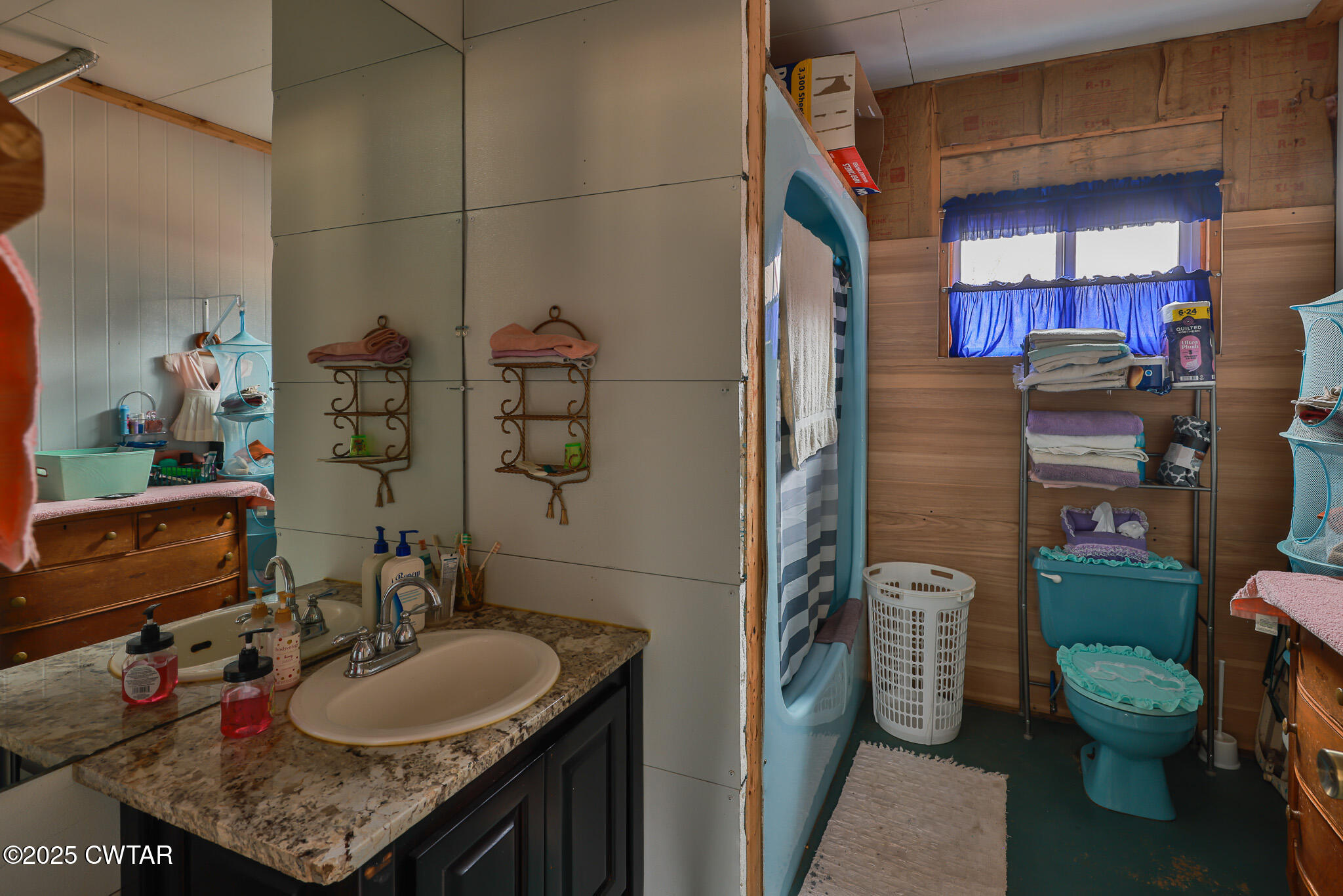 1421 Copper Spring Road Springville, TN 38256 - Photo 38 of 79 a bathroom with a granite countertop sink a toilet and shower