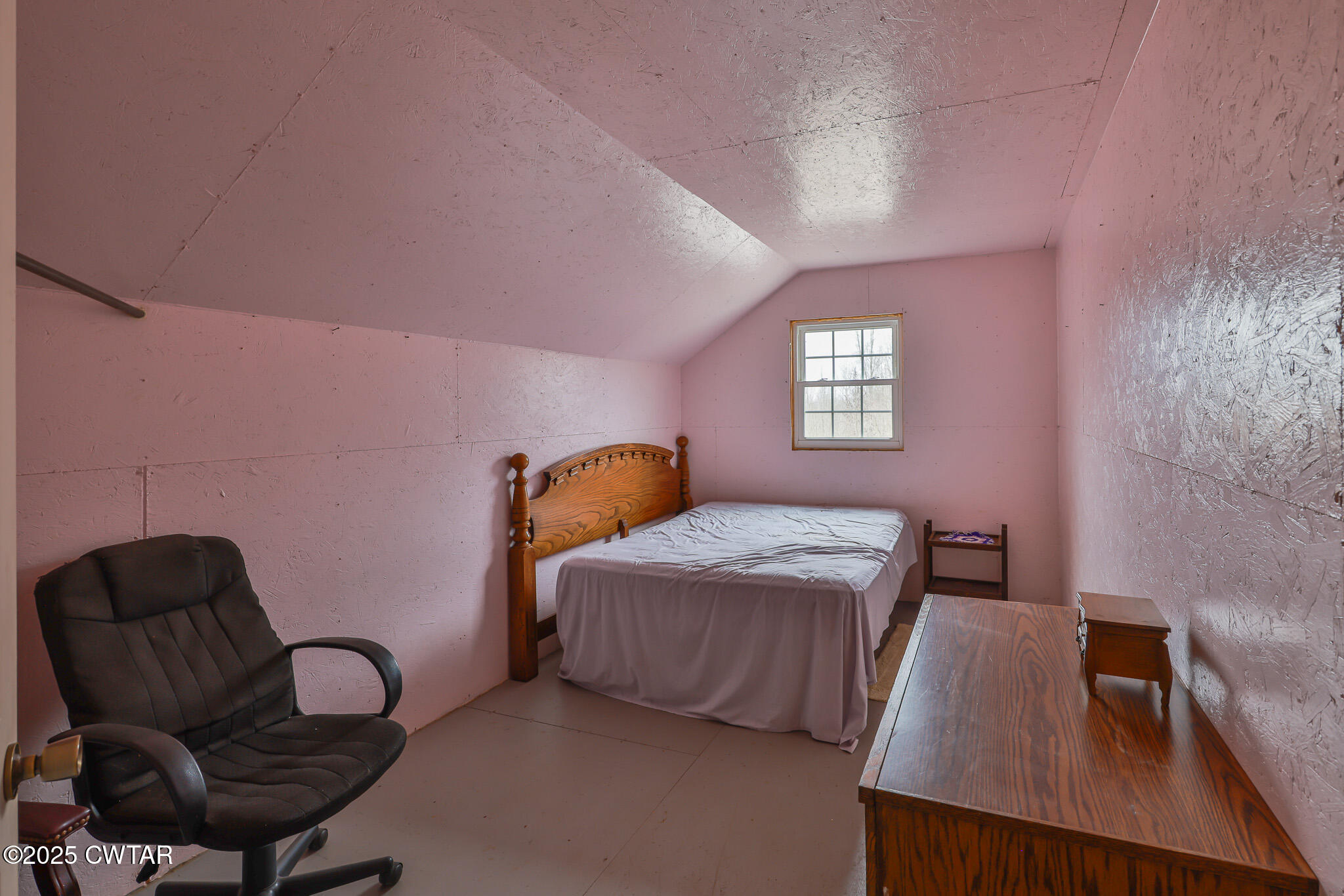 1421 Copper Spring Road Springville, TN 38256 - Photo 39 of 79 a bedroom with a bed window and chair