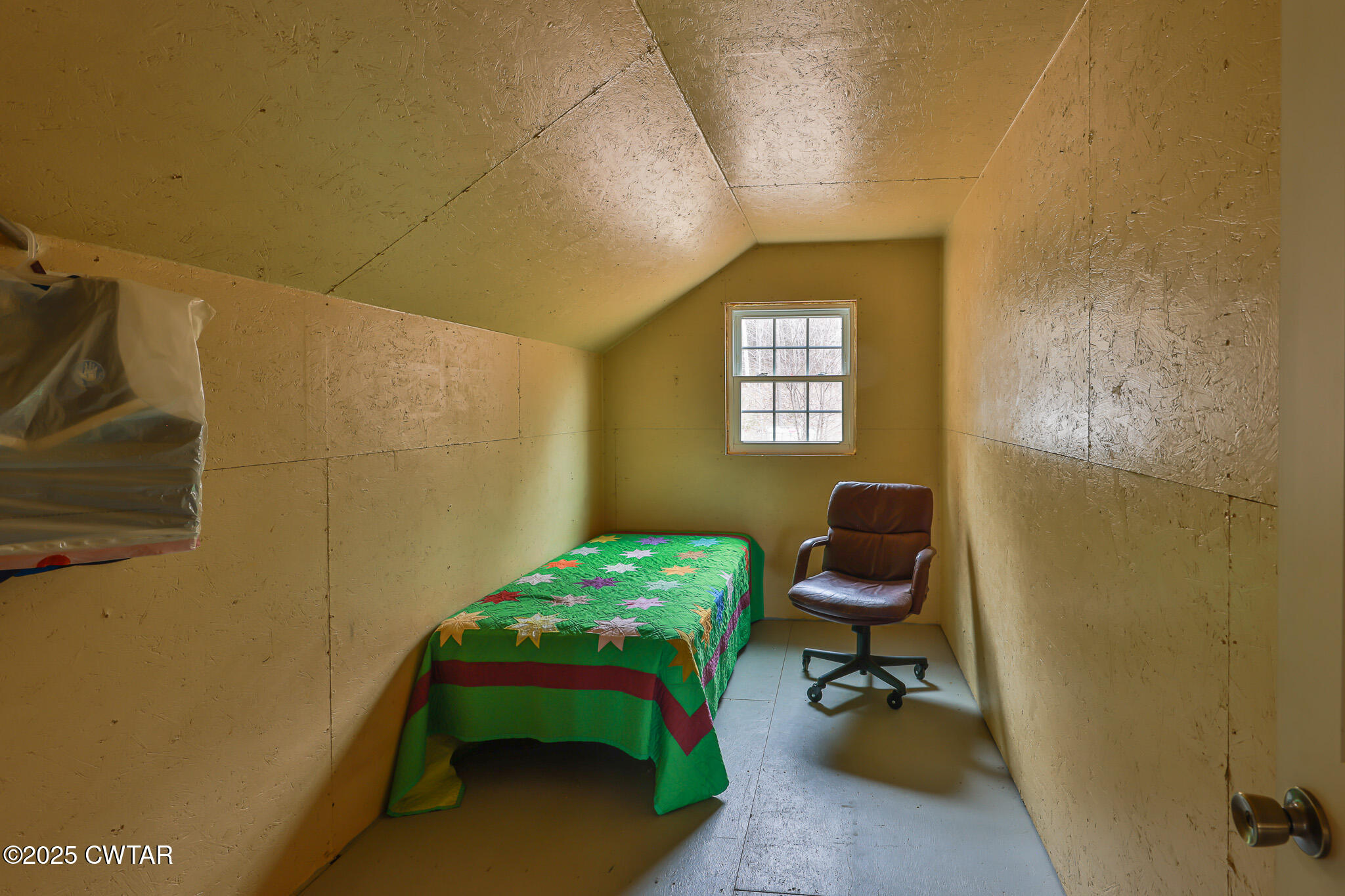 1421 Copper Spring Road Springville, TN 38256 - Photo 41 of 79 a bedroom with a bed and a chair