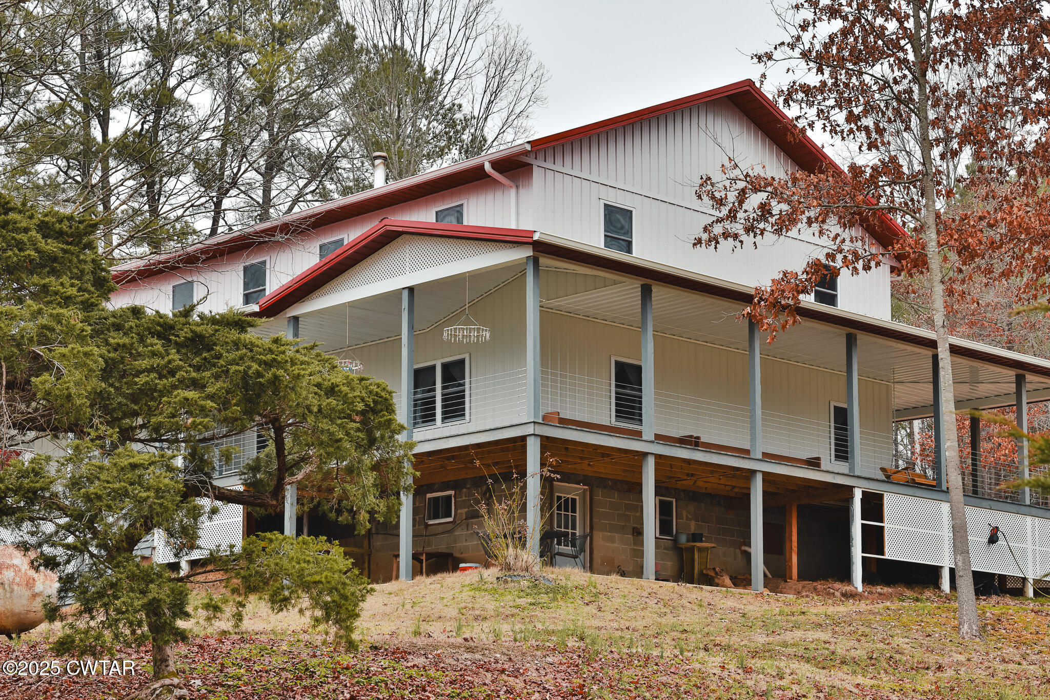 1421 Copper Spring Road Springville, TN 38256 - Photo 10 of 79 a view of a house with a yard and large tree