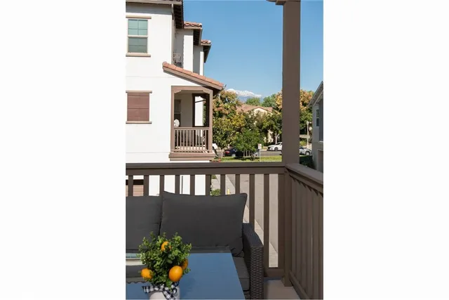 a view of a balcony with chairs