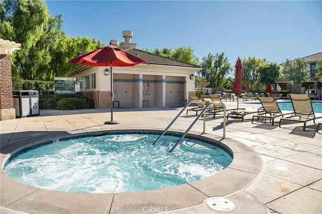 a view of a swimming pool with sitting area