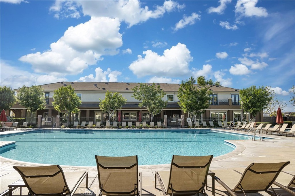 8474 Explorer Street Chino, CA 91708 - Photo 31 of 36 a view of a swimming pool and a back yard