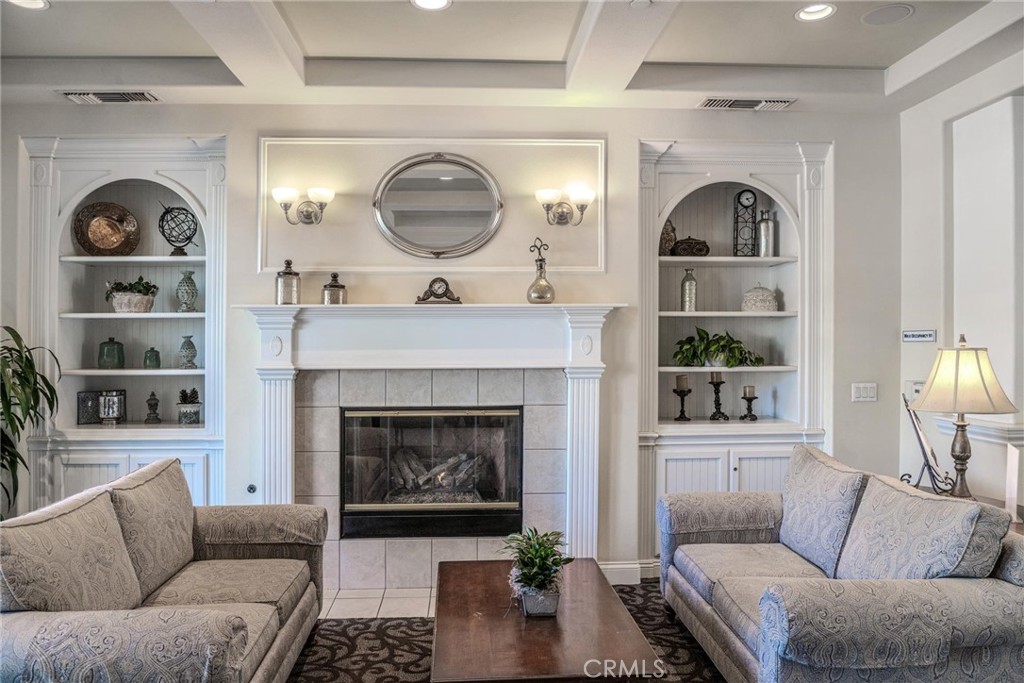 8474 Explorer Street Chino, CA 91708 - Photo 34 of 36 a living room with furniture and a fireplace