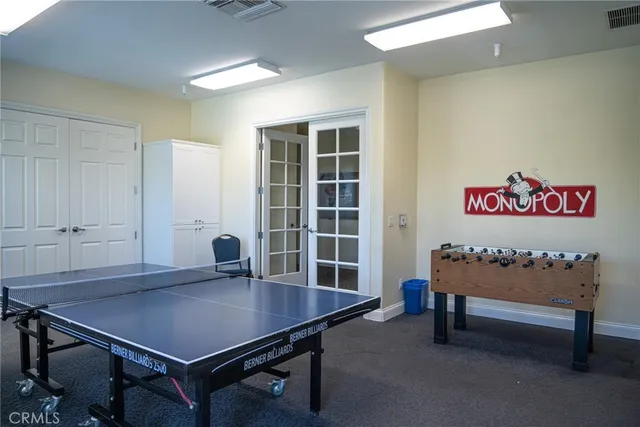 a view of a room with furniture and wooden floor