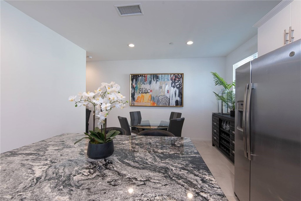 8474 Explorer Street Chino, CA 91708 - Photo 8 of 36 a vase of flowers sitting on a table