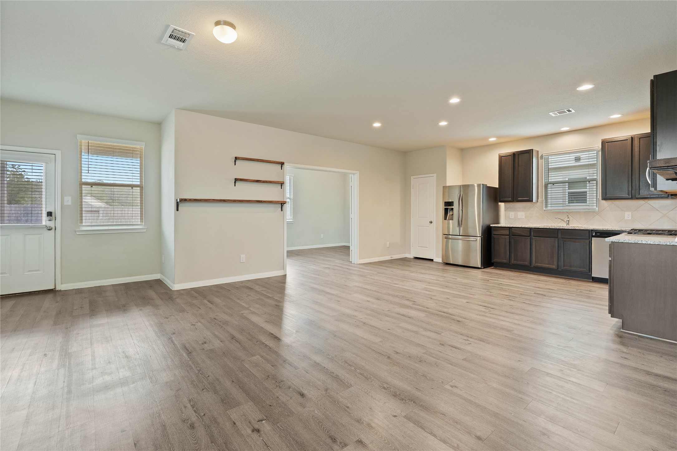 2205 Angie Kaye Drive Conroe, TX 77301 - Photo 12 of 46 a view of kitchen with wooden floor and electronic appliances