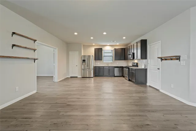 a view of kitchen with wooden floor