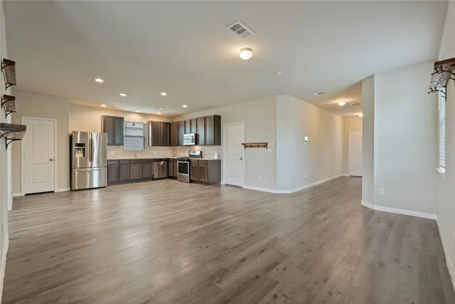 a view of a big room with wooden floors