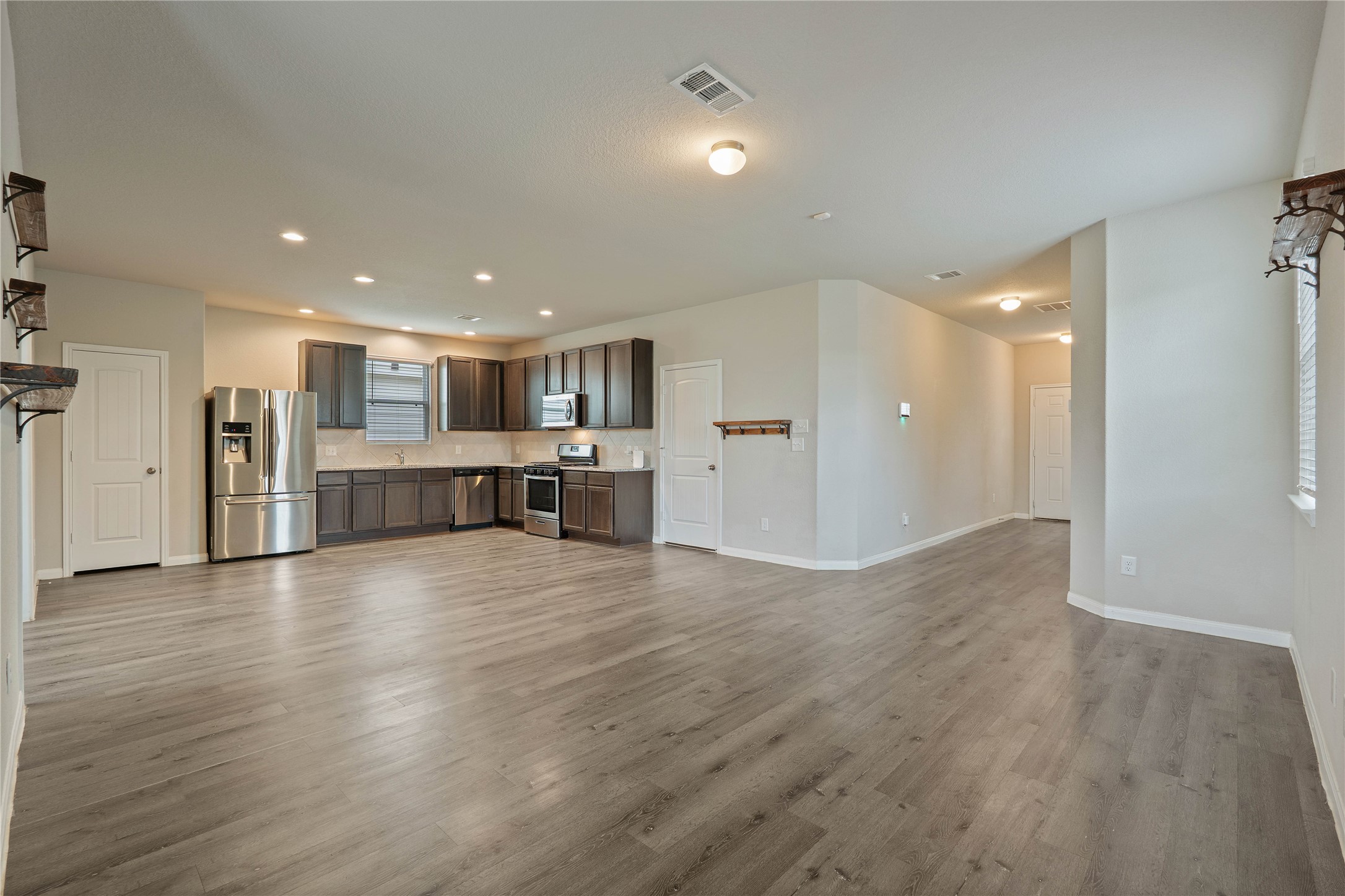 2205 Angie Kaye Drive Conroe, TX 77301 - Photo 14 of 46 a view of a big room with wooden floors