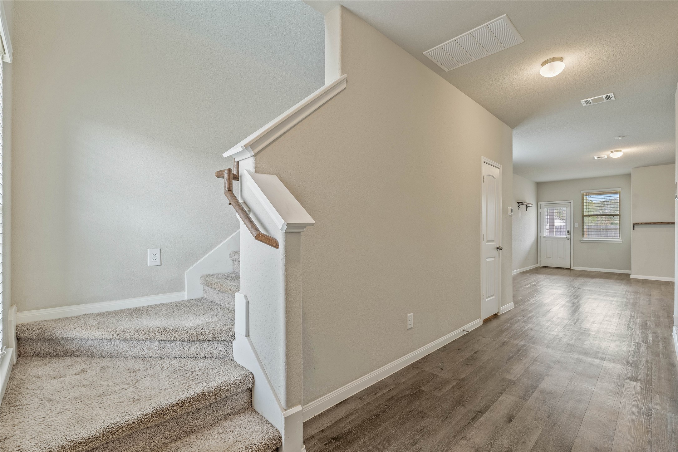 2205 Angie Kaye Drive Conroe, TX 77301 - Photo 18 of 46 a view of entryway and hall with wooden floor