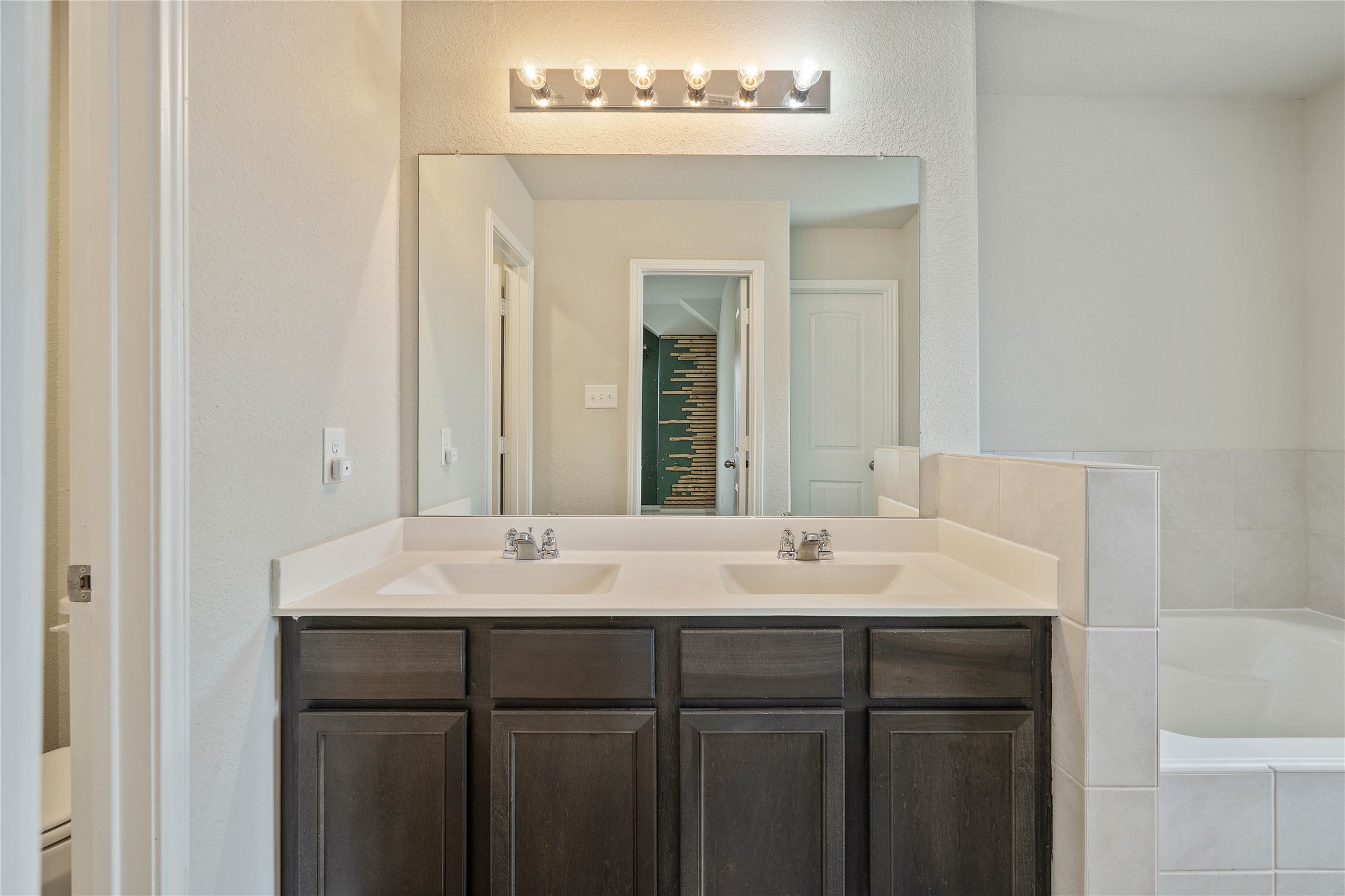 2205 Angie Kaye Drive Conroe, TX 77301 - Photo 26 of 46 a bathroom with a sink and a mirror