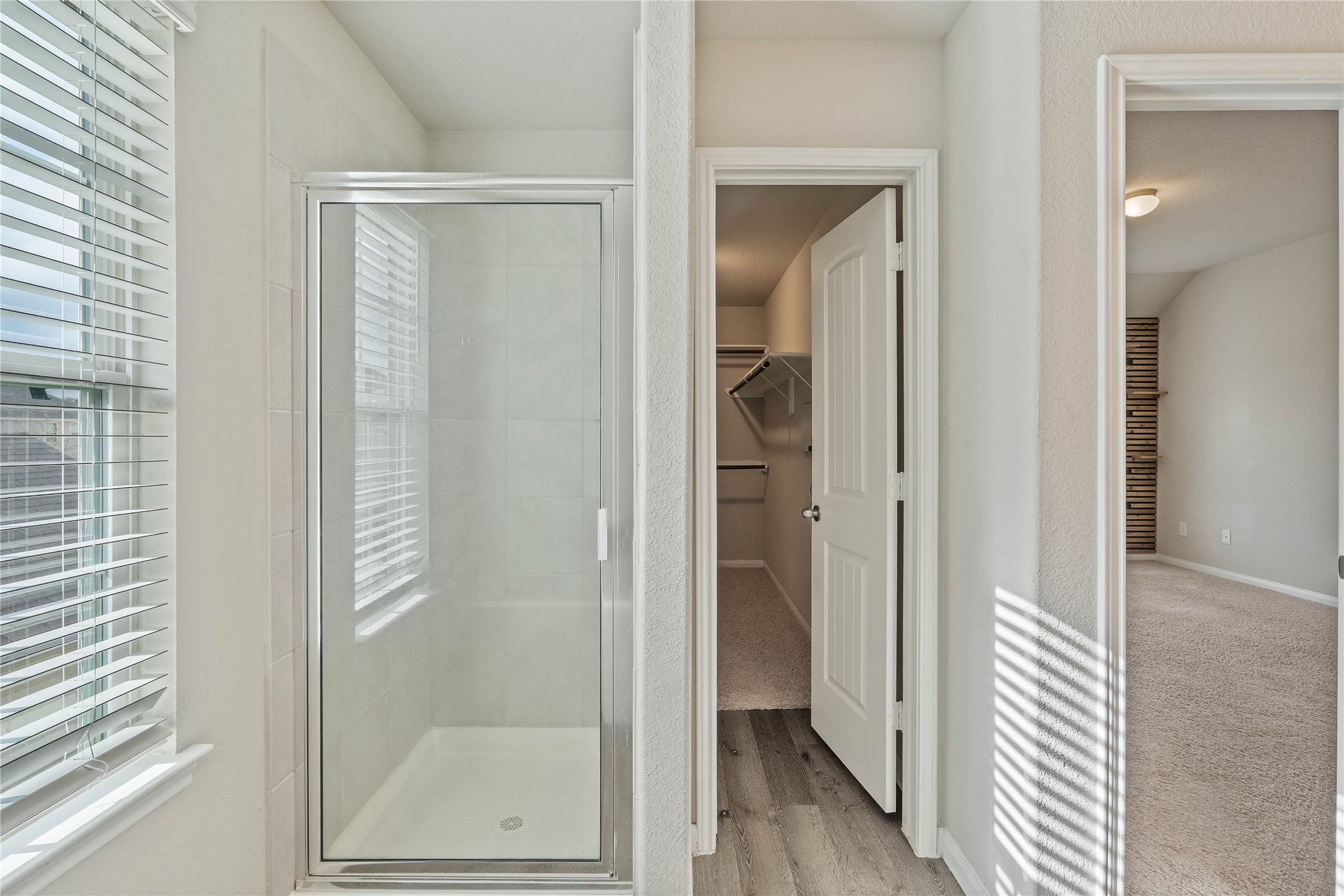 2205 Angie Kaye Drive Conroe, TX 77301 - Photo 29 of 46 a bathroom with a glass shower door