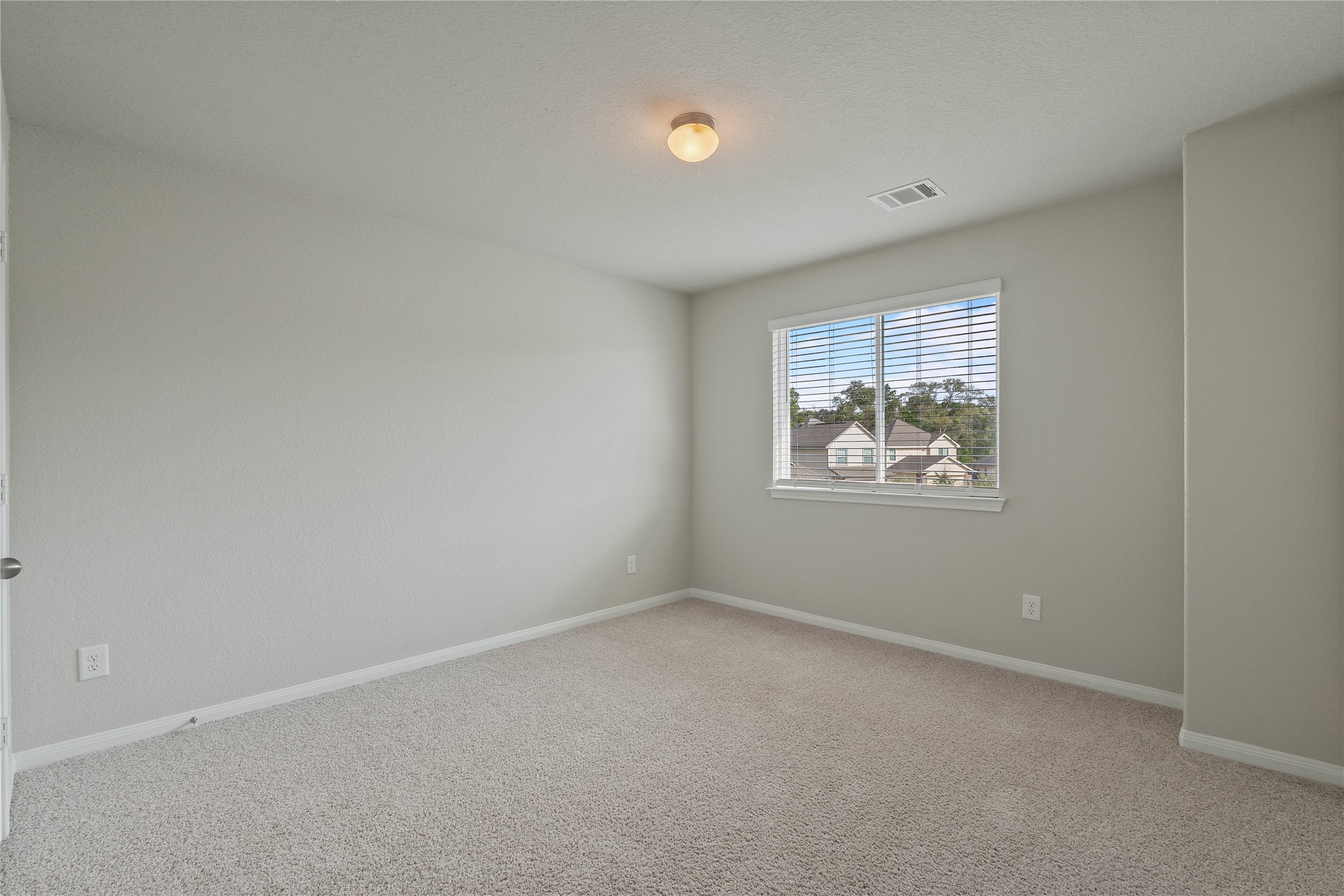 2205 Angie Kaye Drive Conroe, TX 77301 - Photo 31 of 46 an empty room with windows