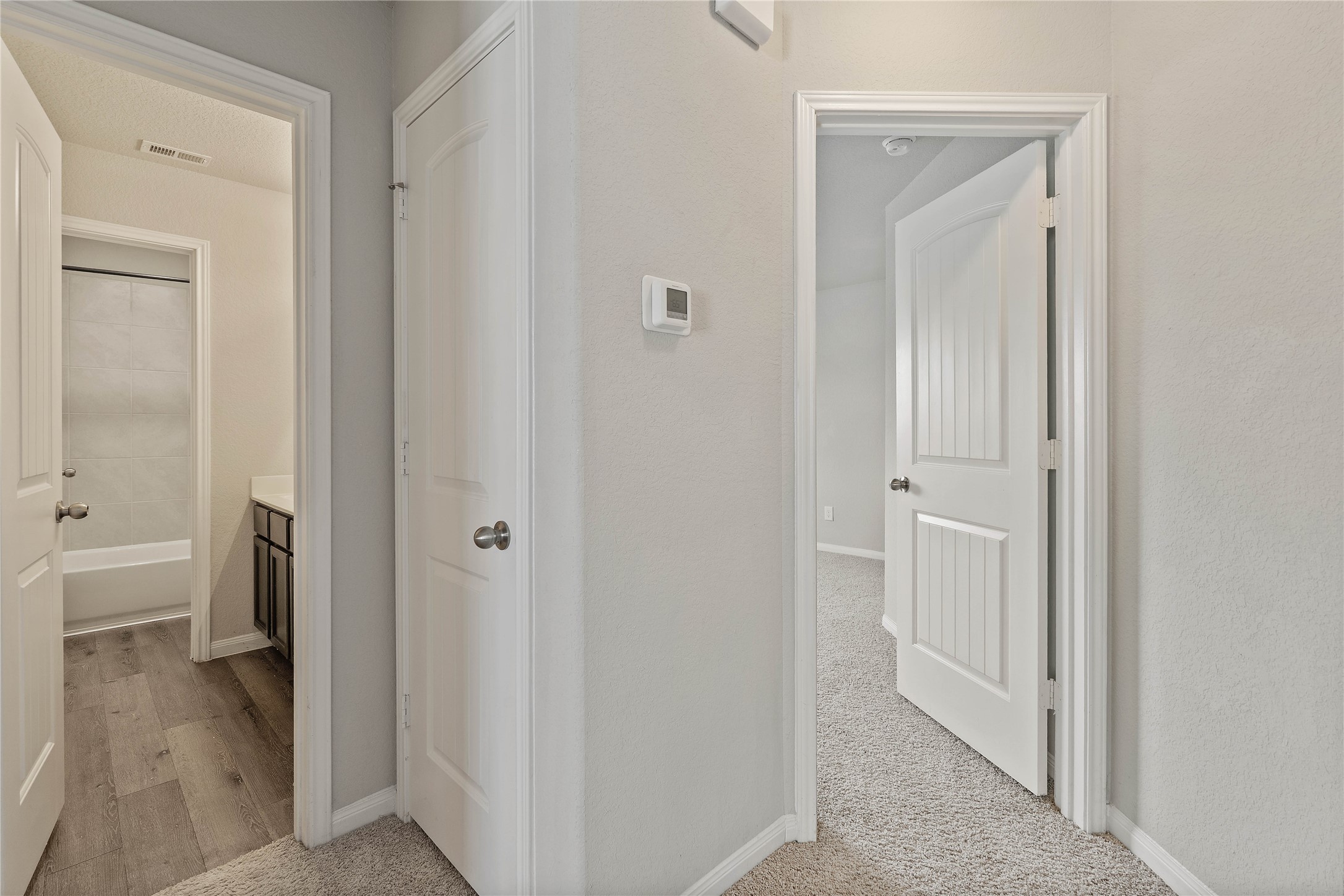 2205 Angie Kaye Drive Conroe, TX 77301 - Photo 33 of 46 a view of a bathroom from a hallway