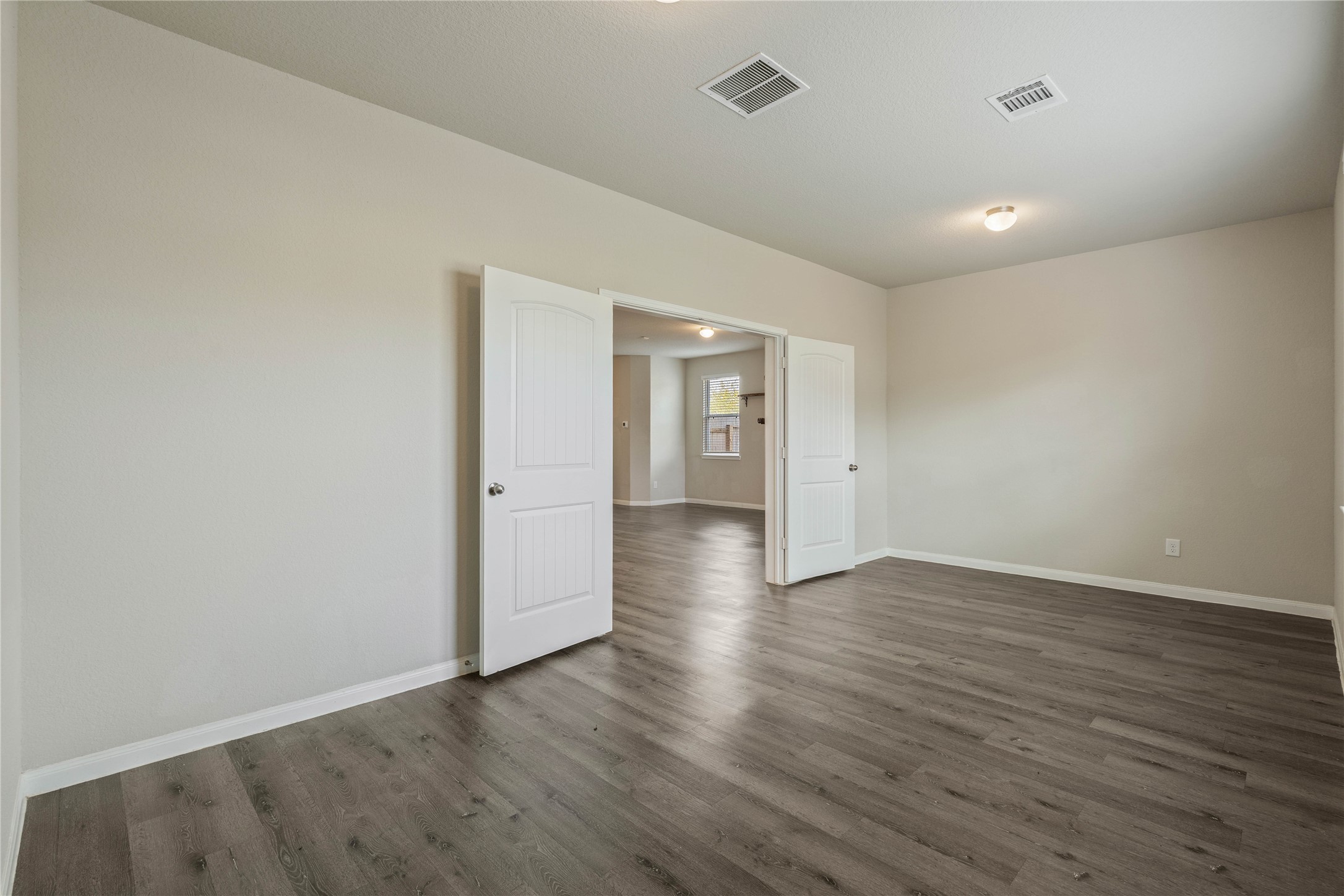 2205 Angie Kaye Drive Conroe, TX 77301 - Photo 37 of 46 a view of an empty room with wooden floor