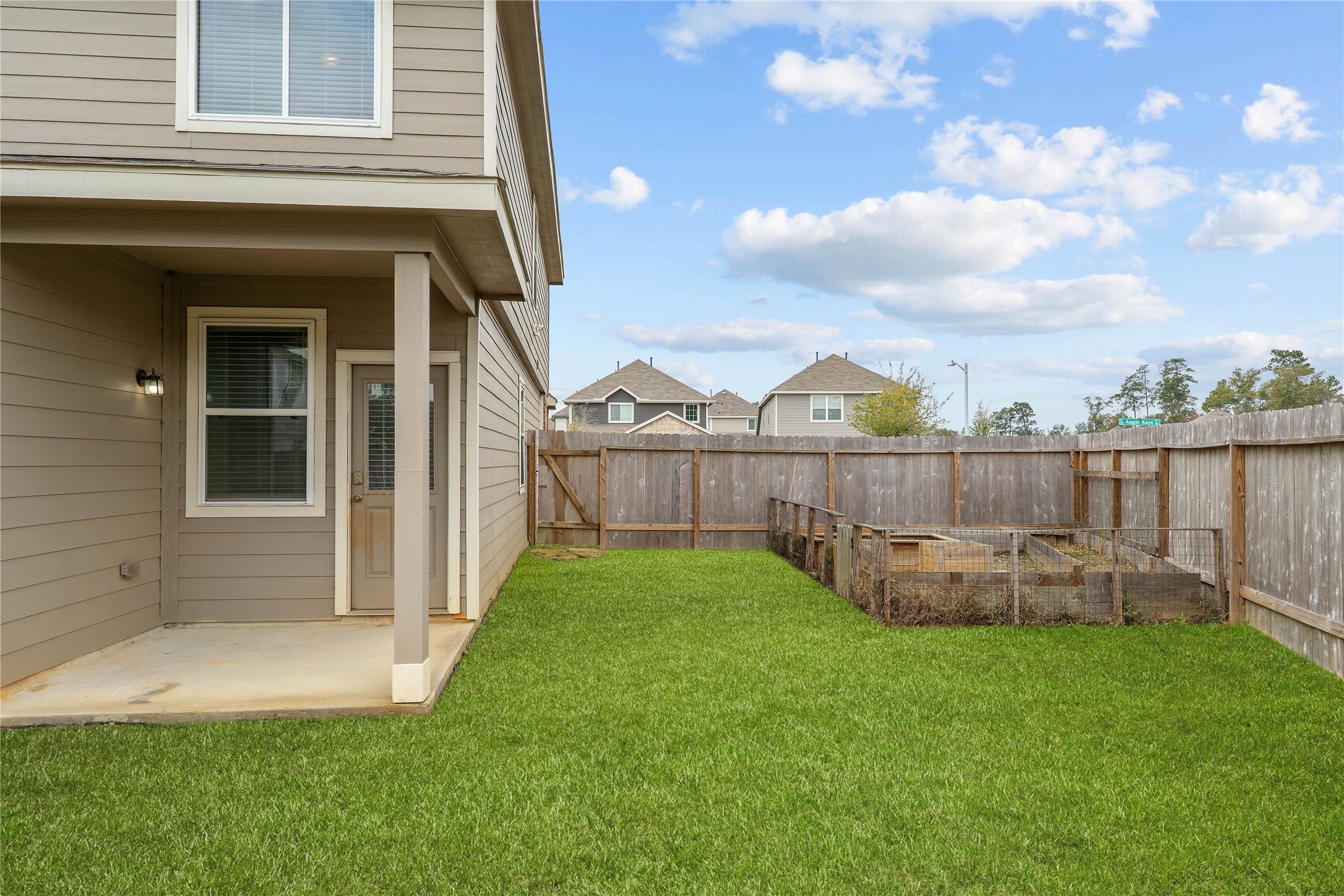 2205 Angie Kaye Drive Conroe, TX 77301 - Photo 39 of 46 a view of a deck with a garden