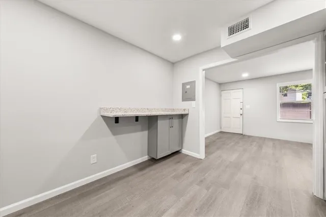 an empty room with a wooden floor