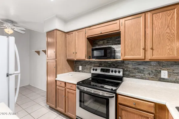 a kitchen with a stove and a microwave